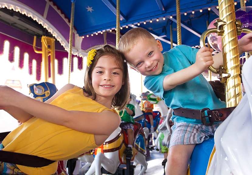 kids on a ride at carnival