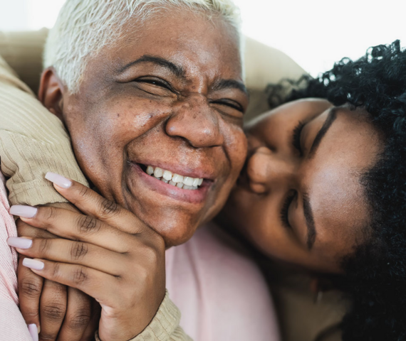 older woman and younger woman hugging